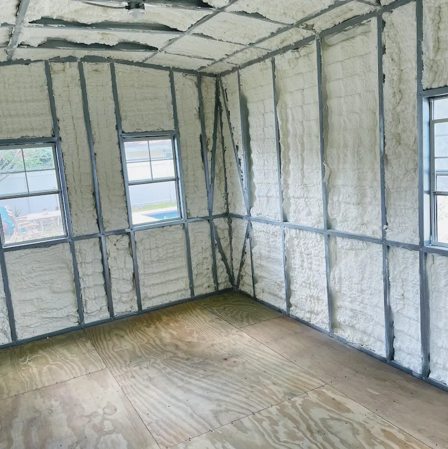 Closed-cell spray foam insulation applied to wall cavities in a residential project in Fort Lee